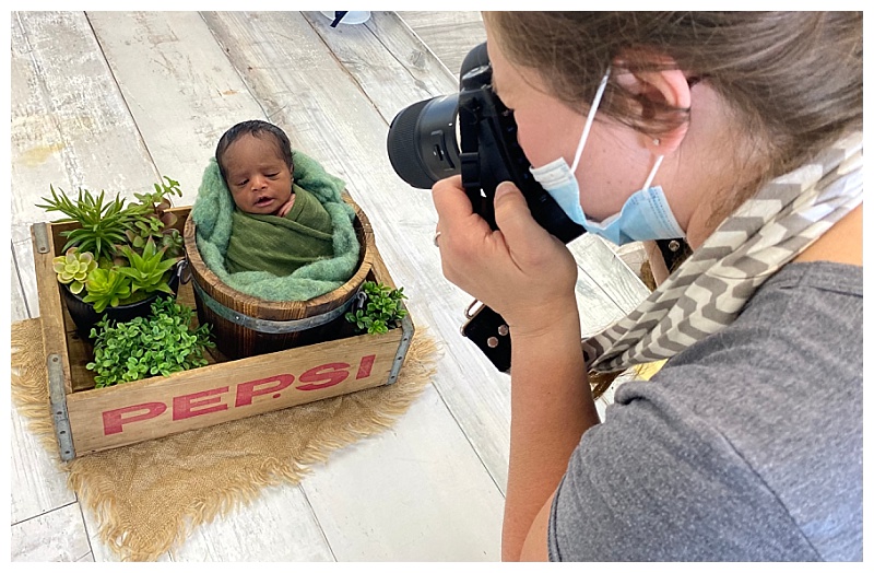 Bobi Biederman photographing a newborn baby in the studio.